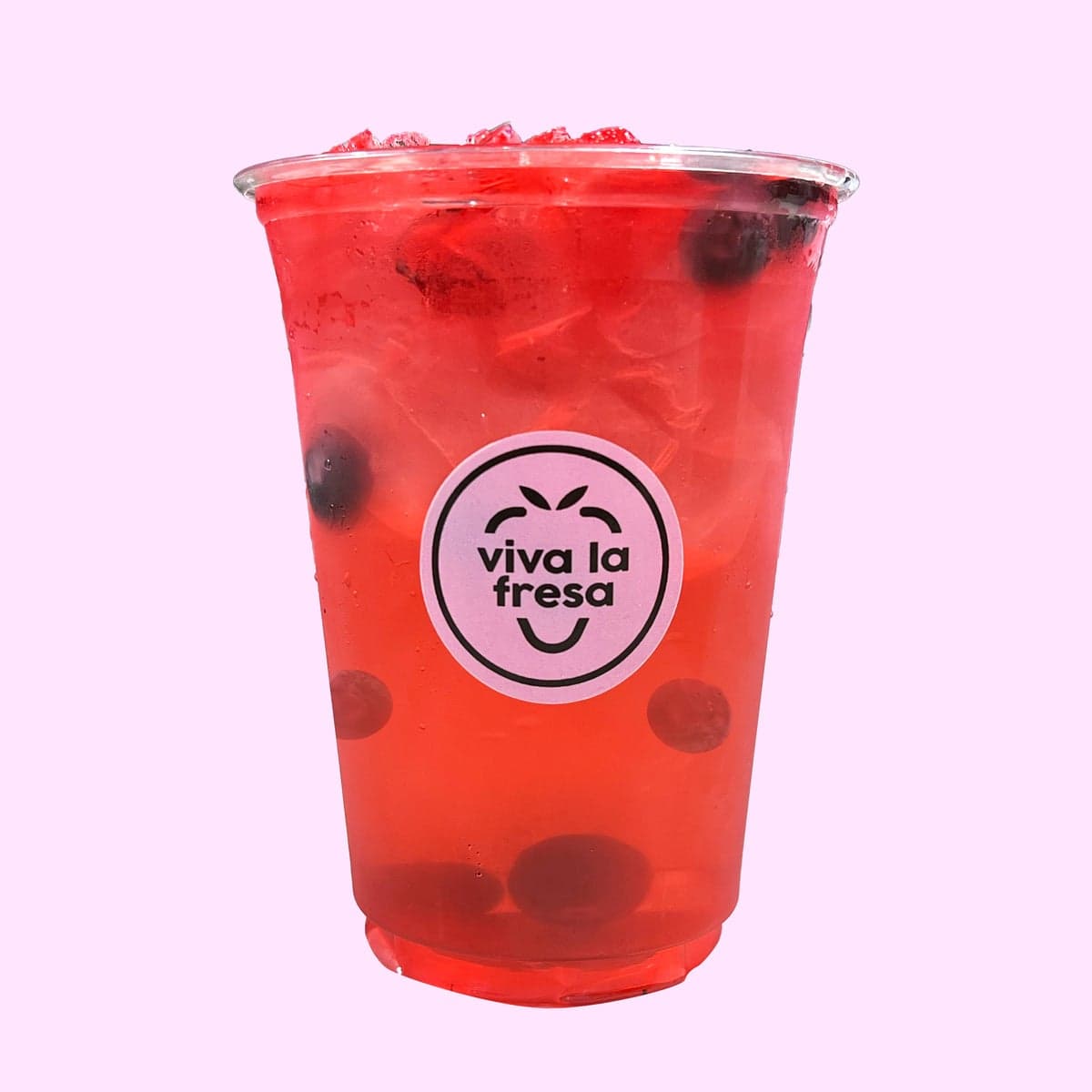 A bright red agua fresca with berries and boba