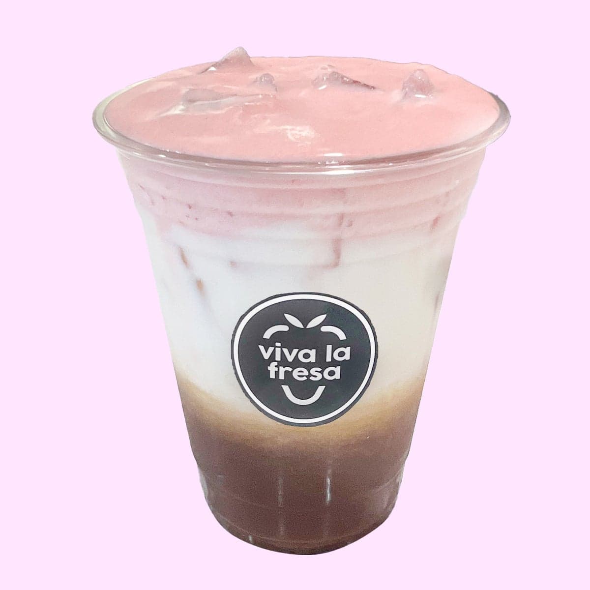 An iced rose chai latte layered in cream and deep red