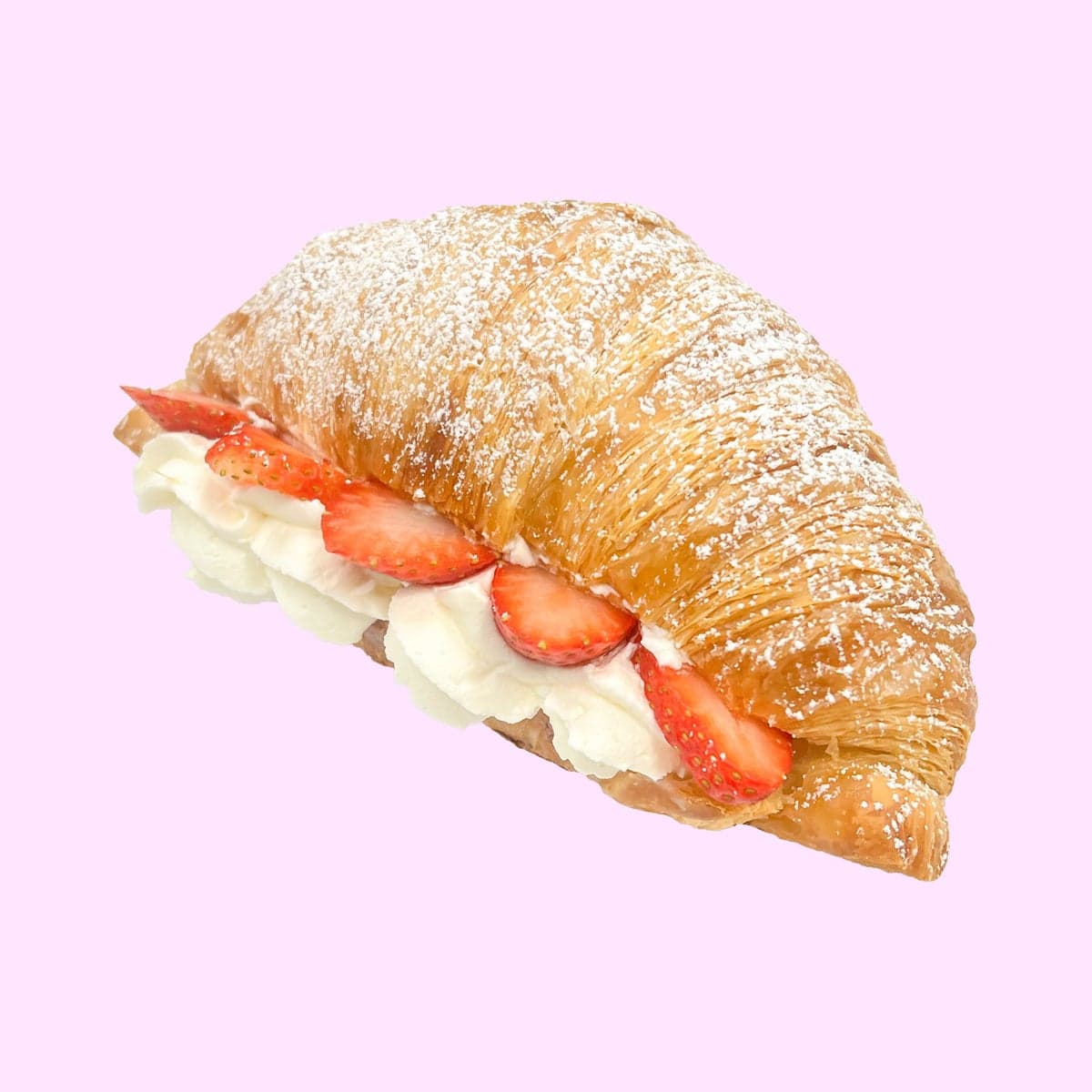 A butter croissant split and filled with strawberry cream, vanilla cream and fresh strawberries