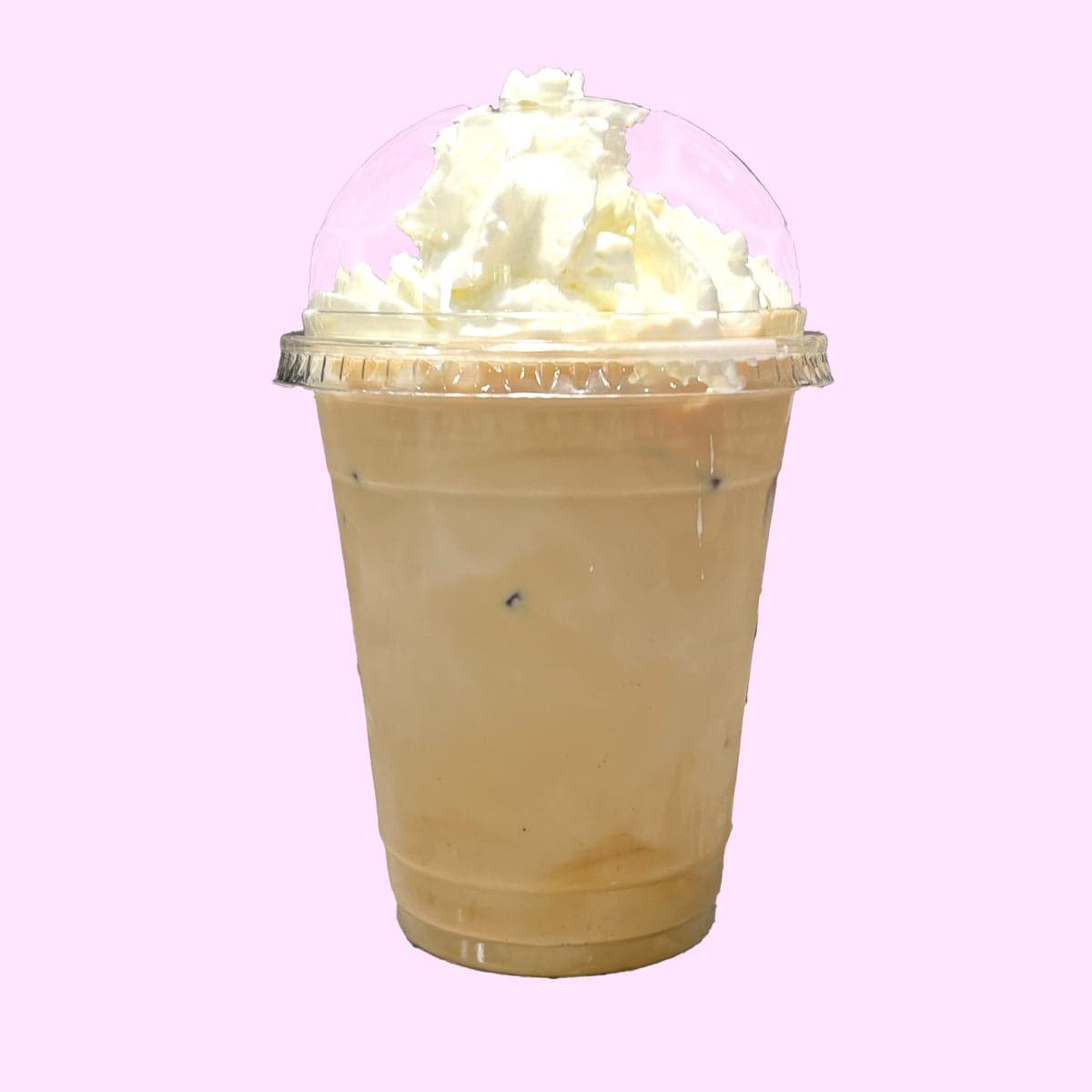 An iced churro latte topped with whipped cream
