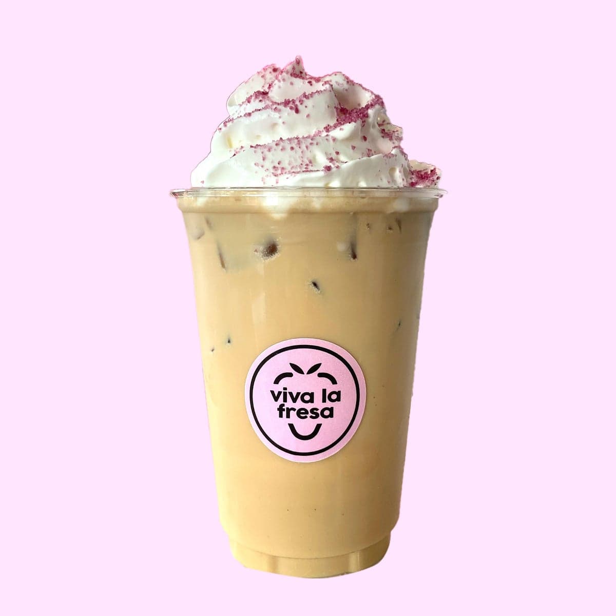 An iced latte topped with cream and dried flower petals