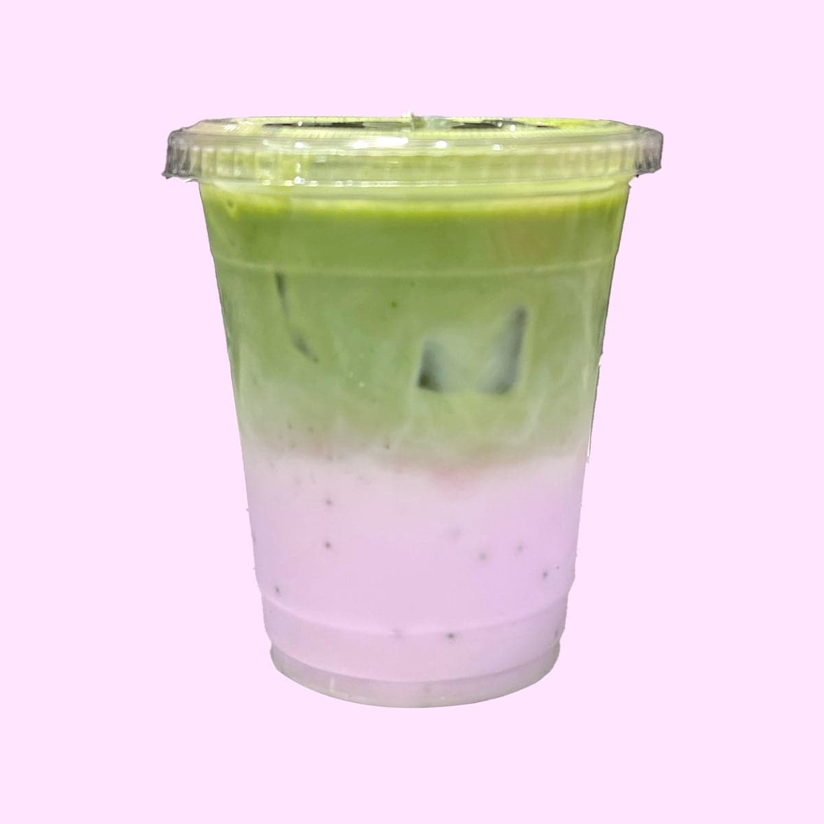 A layered pink and green matcha latte over ice