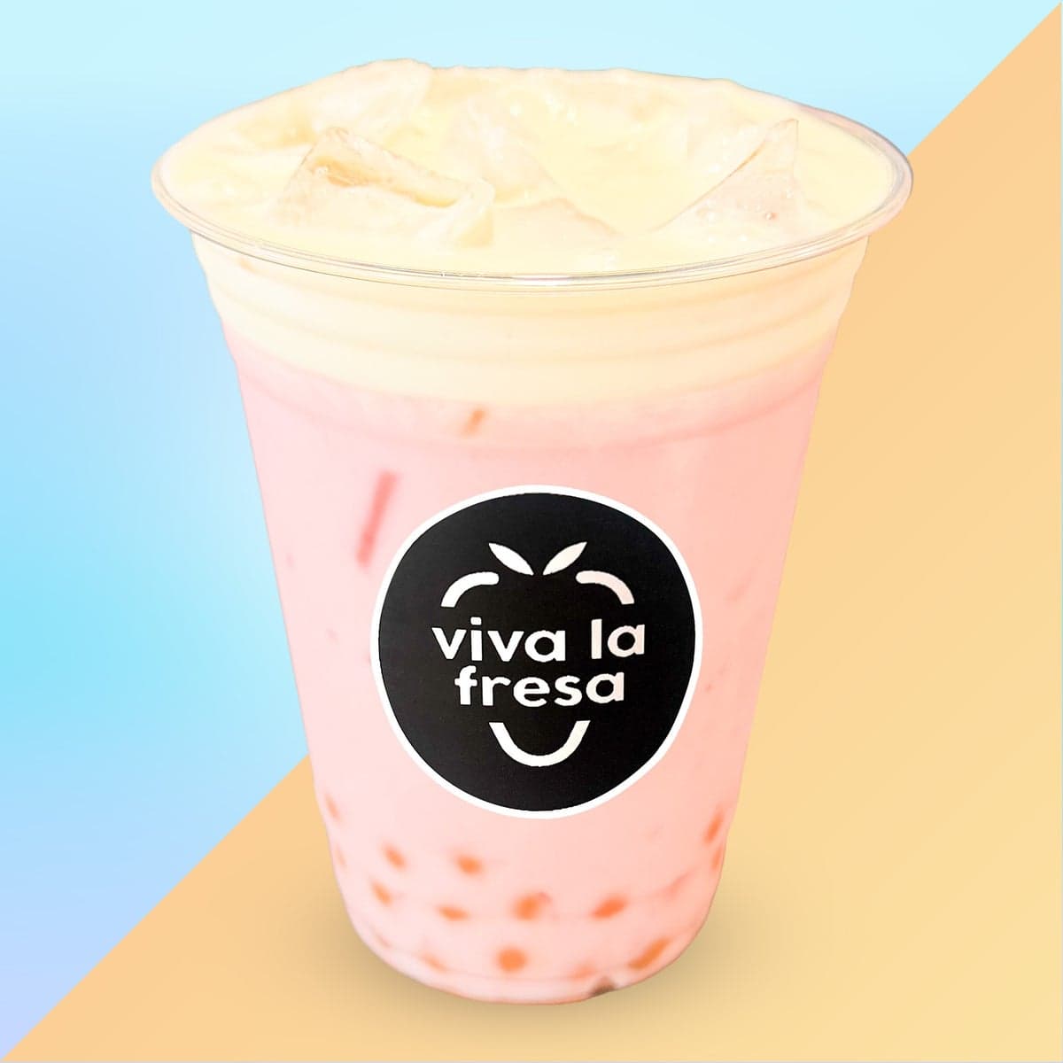 A pink strawberry and coconut agua fresca with popping boba